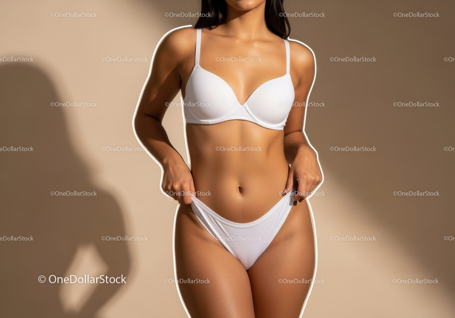Elegant woman in white lingerie poses against warm beige background