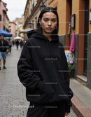 Fashionable Woman Wearing Black Hoodie in Urban City Street