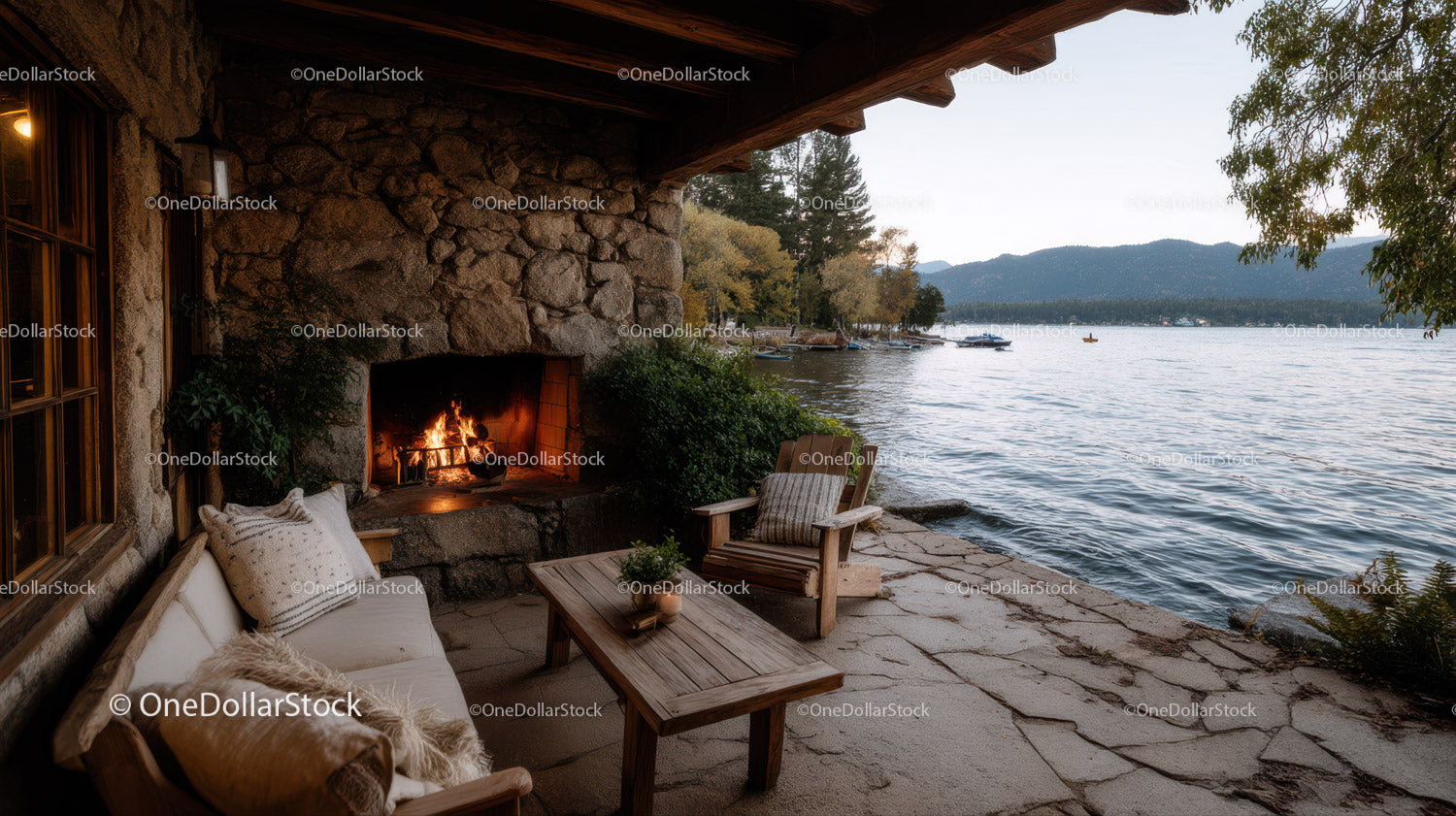 Lakeside Patio with Stone Fireplace and Scenic Water View
