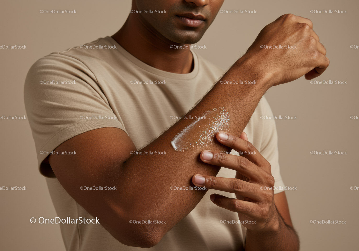 Focus on Man Applying Sunscreen Lotion on Forearm for Skin Protection