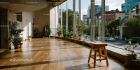 Bright Modern Interior with Green Plants and Large Windows in Urban Setting