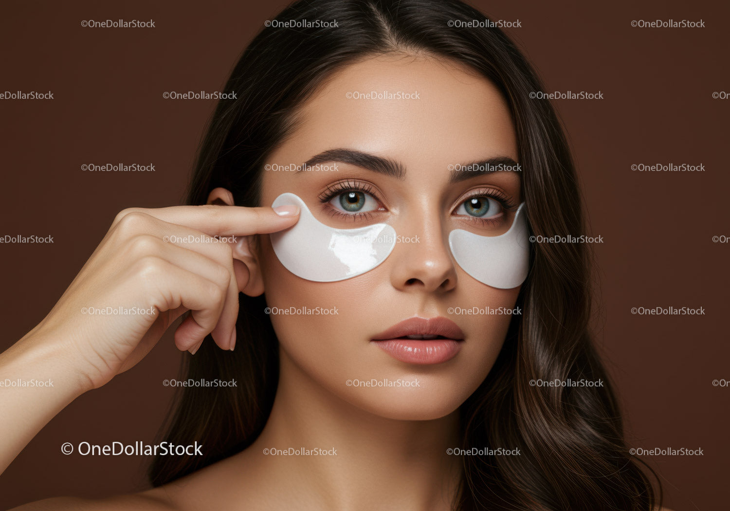 Close-up of a woman with eye patches for skincare treatment