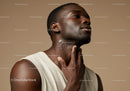 Elegant Male Portrait with Short Hair and Healthy Skin in Neutral Studio Setting