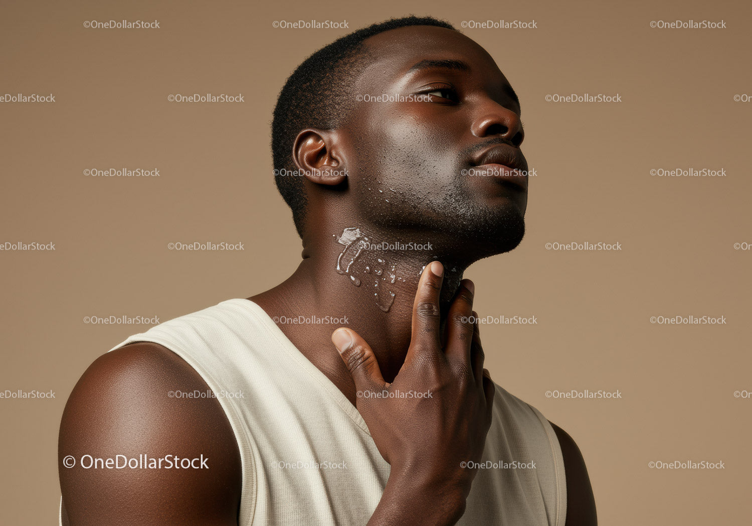 Elegant Male Portrait with Short Hair and Healthy Skin in Neutral Studio Setting