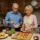 Senior couple preparing colorful appetizer snacks in kitchen