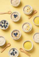Bowls of Healthy Porridge with Fresh Fruit and Grains