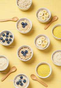 Bowls of Healthy Porridge with Fresh Fruit and Grains
