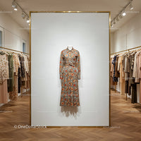 Floral patterned dress on mannequin in boutique display