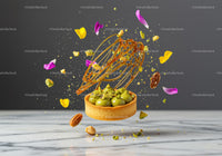 Pistachio tart with caramel decorations and flower petals