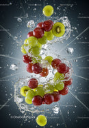 Fresh grapes and kiwi splashing in water with ice