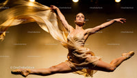 Graceful ballerina mid-air performing an elegant leap