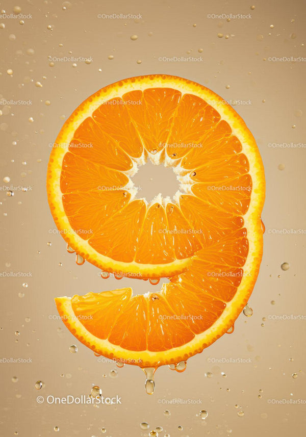 Fresh Orange Slice Shaped Like Number Nine With Droplets