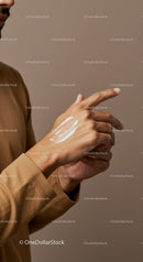 Close Up of Man Applying Lotion to Hand for Skin Hydration