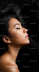 Peaceful profile of woman with flowing black hair