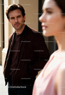 Thoughtful man looking at woman in soft daylight