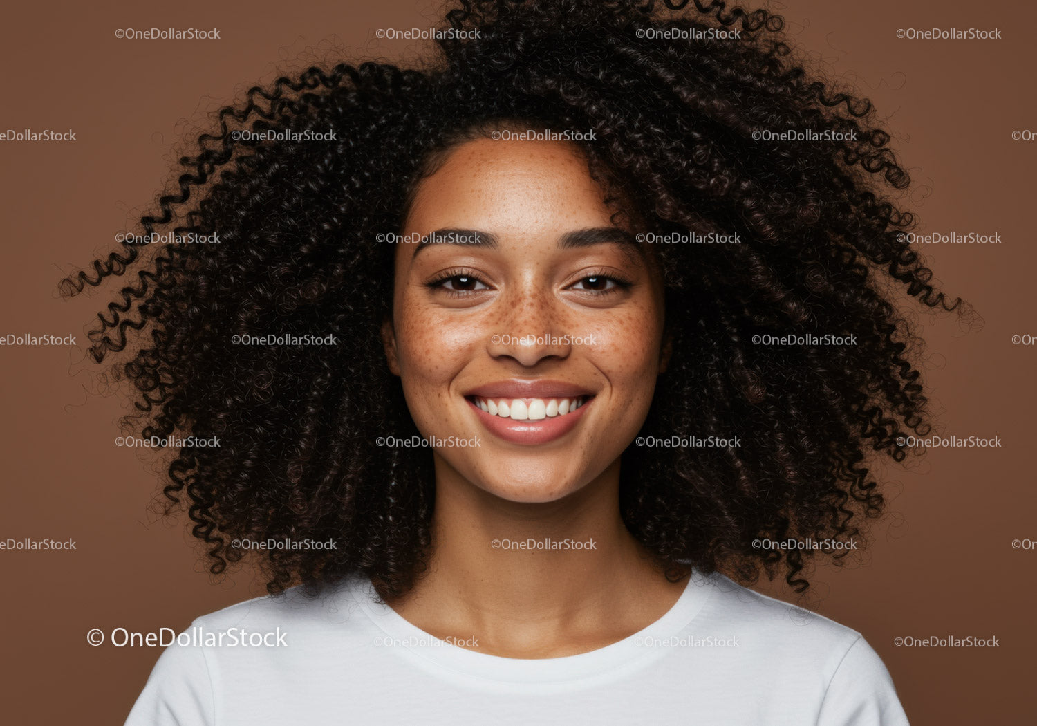 Portrait of a Smiling Woman with Curly Hair and Freckles