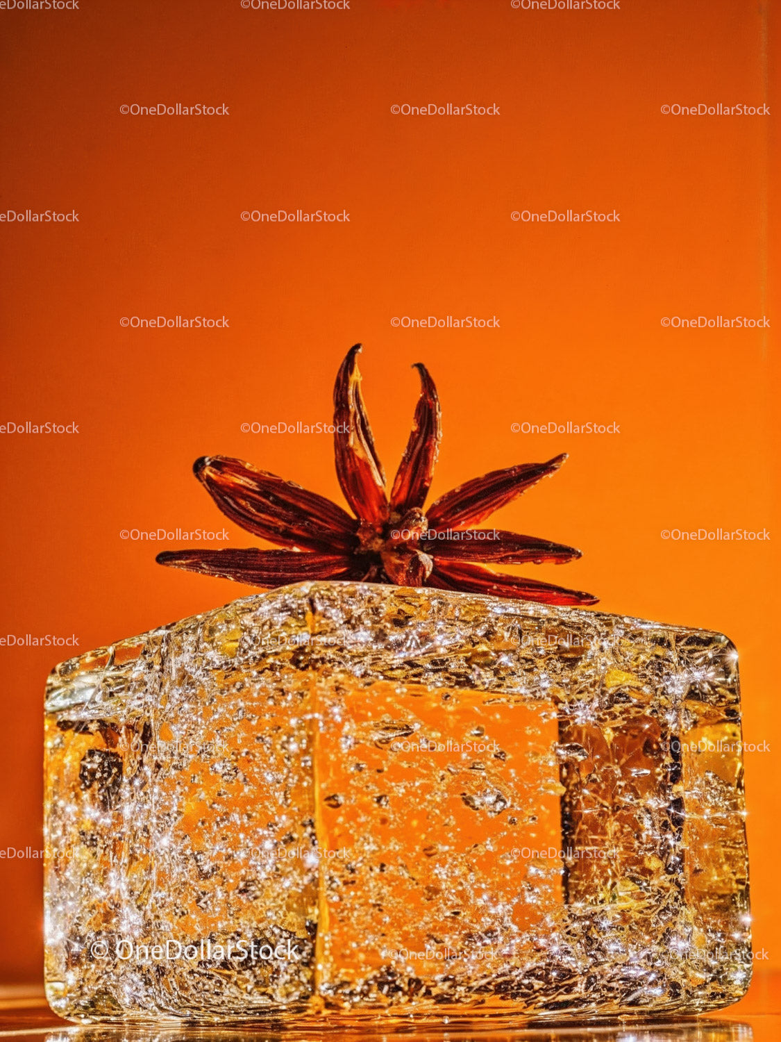 Star Anise on Textured Ice Block with Orange Background