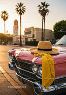 Vintage Pink Car with Straw Hat and Yellow Dress Fabric in Sunset