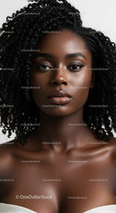 Elegant Portrait of a Beautiful Woman with Curly Hair and Glowing Skin