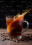 Cream Splashing into Hot Coffee in Glass Mug