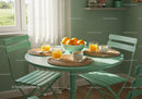 Cozy breakfast setting with fresh orange juice and coffee