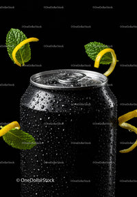 Black soda can with fresh mint and lemon peel accents