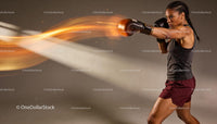 Focused female boxer delivering a powerful punch