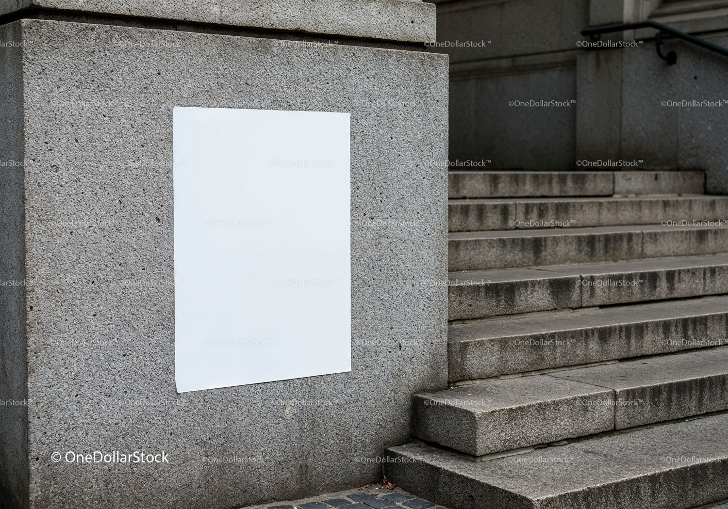 Blank white poster on textured concrete wall near stairs