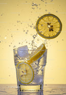 Refreshing lemon slices splashing into sparkling water