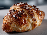 Chocolate Chip Croissant with Powdered Sugar and Crispy Flaky Layers