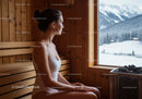 Woman Relaxing in Sauna with Mountain Snowfall View