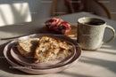 Fresh Herb Bread with Coffee and Pomegranate on Cozy Morning Table