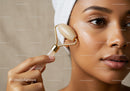 Beautiful Woman Using Jade Roller for Facial Skincare and Rejuvenation