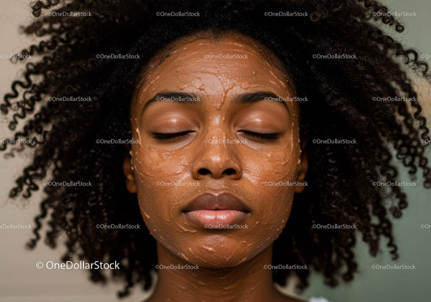 Woman with Curly Hair Applying Facial Mask for Skincare Routine