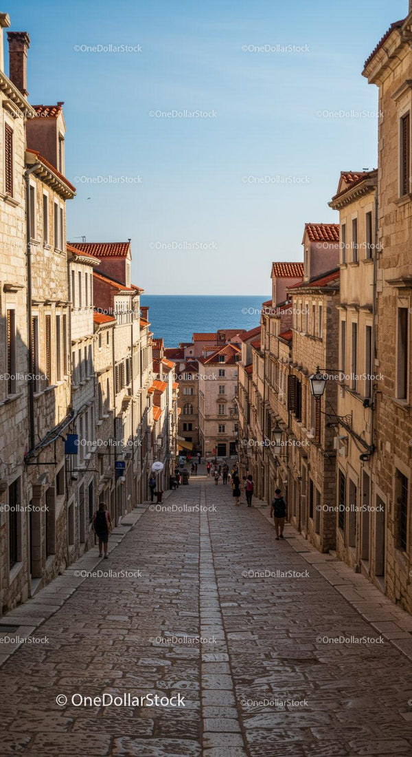 Charming Coastal Town Street with Historic Mediterranean Buildings and Sea View