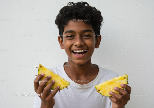 Joyful Child Holding Fresh Pineapple Slices in Bright Summer Atmosphere