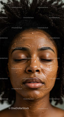 Beautiful Woman with Curly Hair Relaxing with Facial Mask