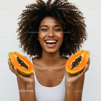 Vibrant Woman Holding Juicy Papaya Slices for Healthy Lifestyle
