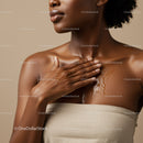 Portrait of a Black Woman Applying Coconut Oil on Her Shoulder