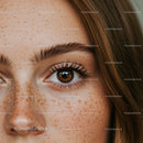 Close-up Photo of a Woman's Eye with Freckles and Long Lashes