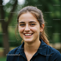 Young Woman Smiling Outdoors in a Natural Environment
