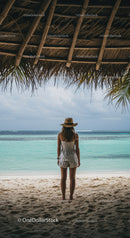 Woman in Straw Hat Standing on Tropical Beach Under Palapa Roof