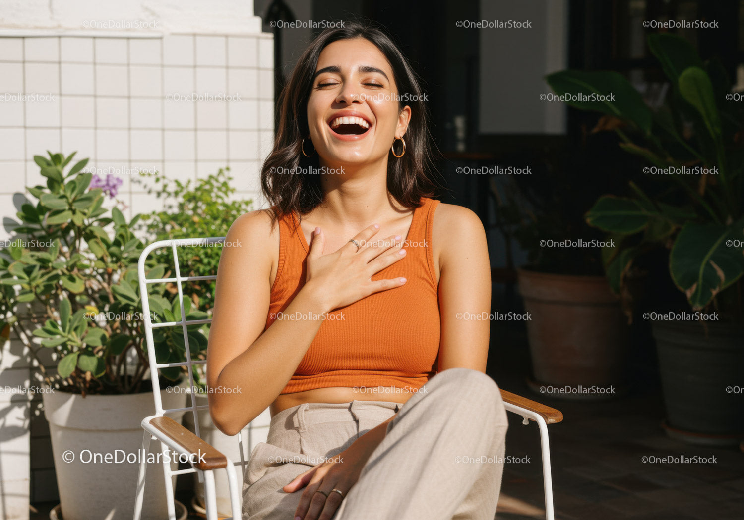 Joyful Woman Laughing and Relaxing Outdoors in Bright Sunlight