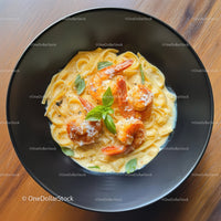 Seafood Pasta with Shrimp and Basil Garnish in a Black Bowl