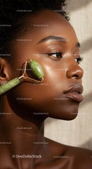 African Woman Using Jade Roller for Facial Skin Care and Beauty