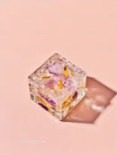Decorative ice cube with colorful flower petals