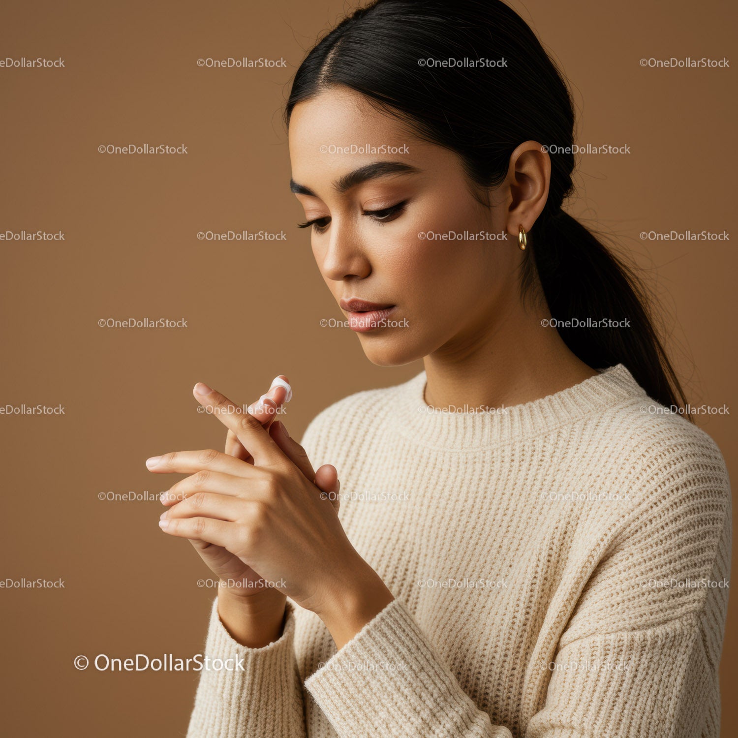 Elegant Woman Applying Skincare Lotion for Healthy Glow