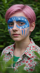 Portrait of a Youth with Artistic Face Paint in a Green Setting
