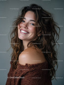 Portrait of a Smiling Woman with Curly Hair in Casual Attire