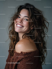 Portrait of a Smiling Woman with Curly Hair in Casual Attire